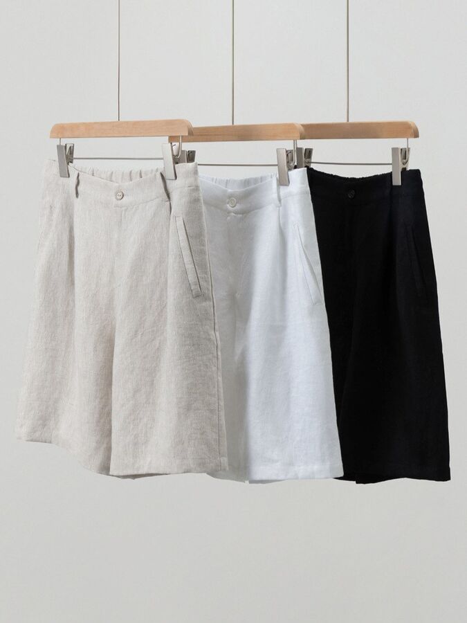 White linen shorts in oatmeal, white, and black